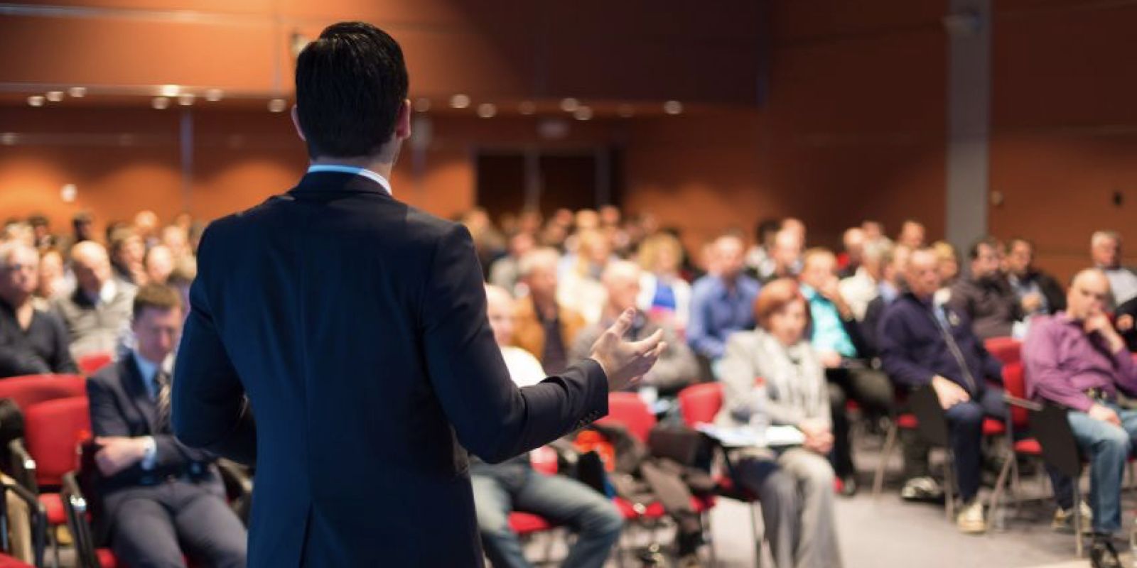 Speaker presenting to an audience